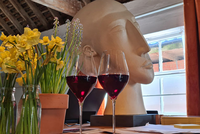 Two glasses of Pinot Noir on the bar at Artelium near Brighton